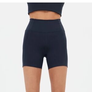 Girlfriend Hi-Rise Run Biker Short in Midnight